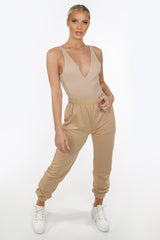 Nude Ribbed Plunge Neck Bodysuit