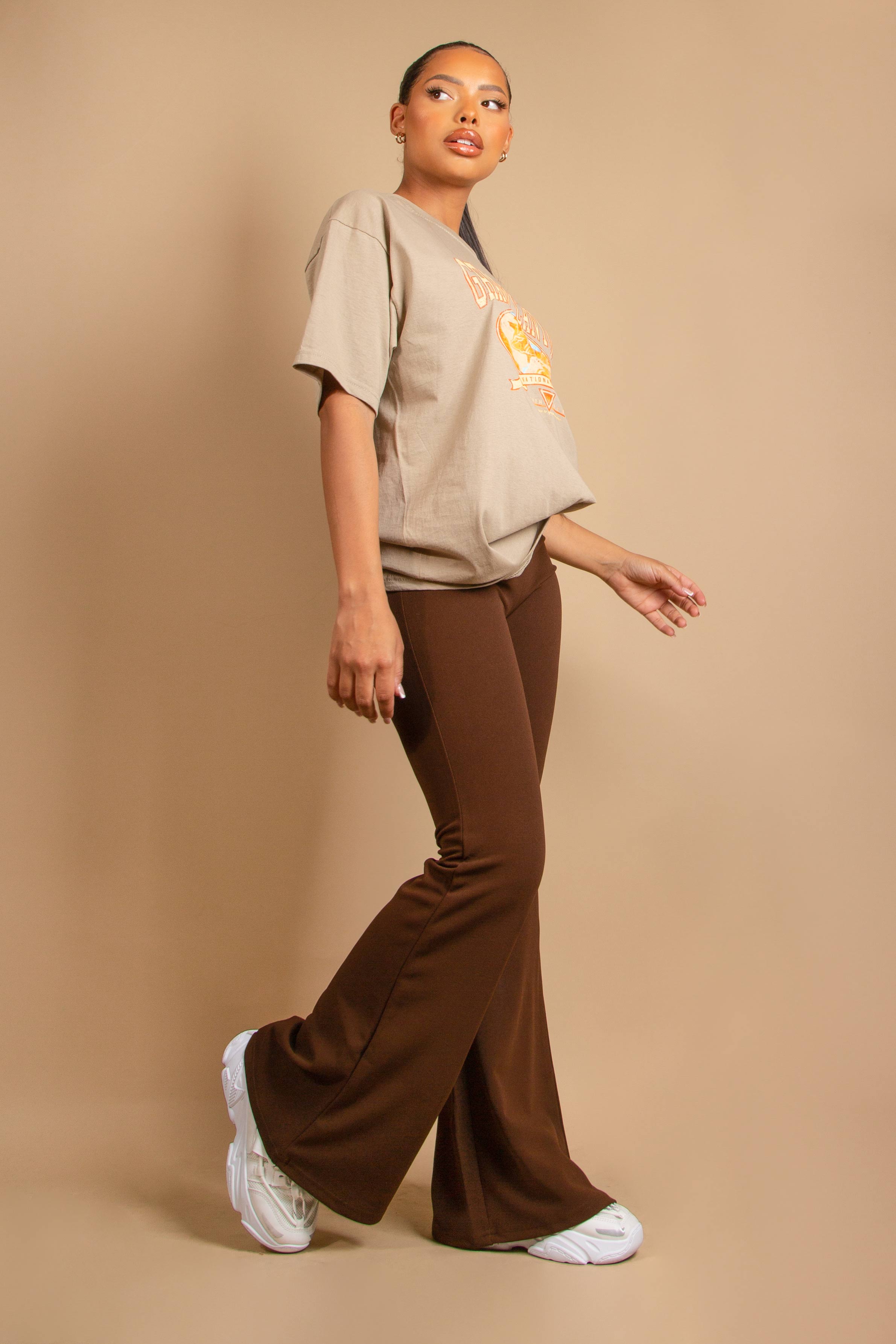 https://www.dressedinlucy.com/cdn/shop/products/brown-flare-trousers-1.jpg?v=1705072411